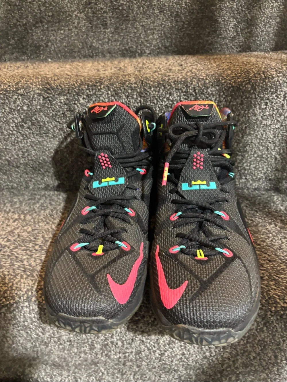 The Nike LeBron 12 Data Size 13 in black/orange colorway features icy bottoms,